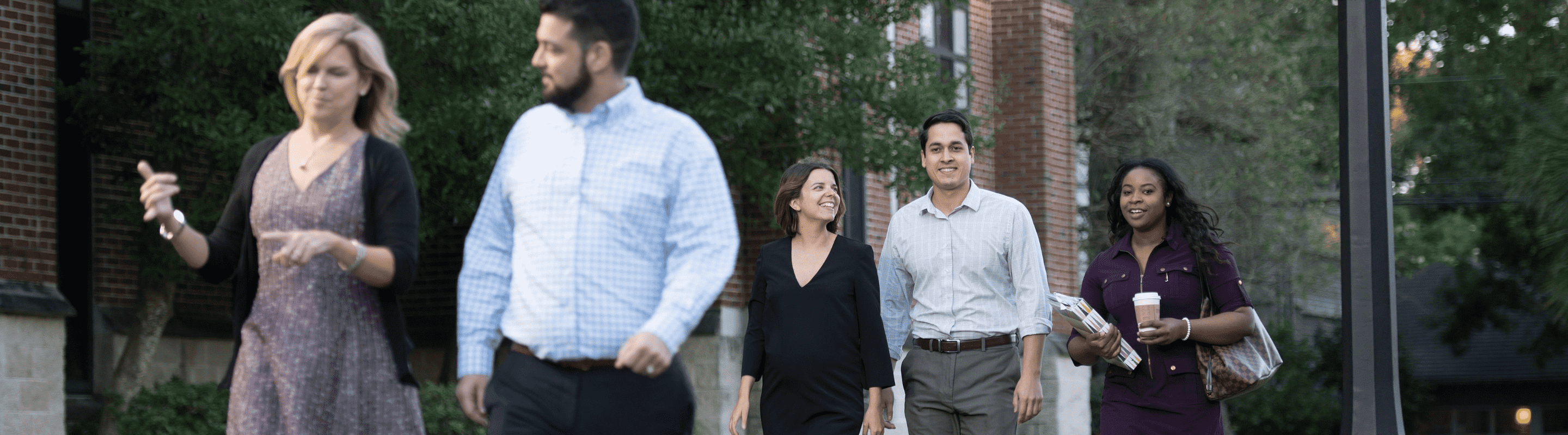 Graduate students walking around Loyola's campus.